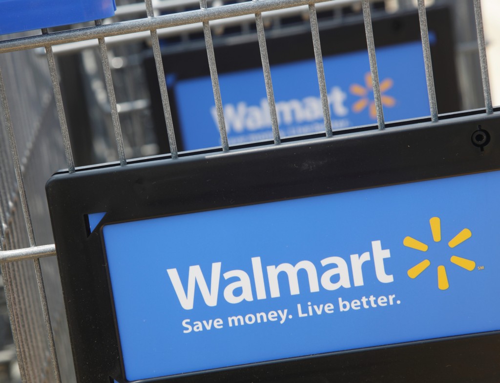 Workers walk through a new Wal-Mart store in Chicago