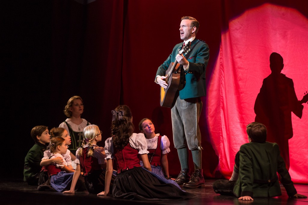 Ben Davis, who plays Captain von Trapp, with Kerstin Anderson, who plays Maria Rainer, and the von Trapp children in the national tour of Rodgers & Hammersteins The Sound of Music, directed by Jack OBrien, now playing at the Center Theatre Group/Ahmanson Theatre through October 31, 2015. Tickets are available at CenterTheatreGroup.org or by calling (213) 972-4400.	 Contact: CTG Media and Communications / (213) 972-7376 / CTGMedia@ctgla.org Photo by Matthew Murphy.