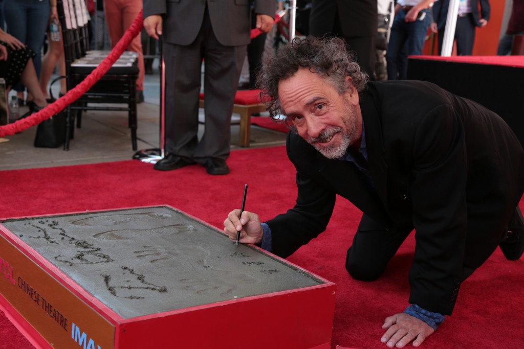 Tim Burton celebrates at his Hand & Footprint Ceremony presented by 20th Century Fox in celebration of his newest film "Miss Peregrine's Home for Peculiar Children" at the TCL Chinese Theatre in Los Angeles, CA on September 8, 2016.  (Photo: Alex J. Berliner/ABImages)