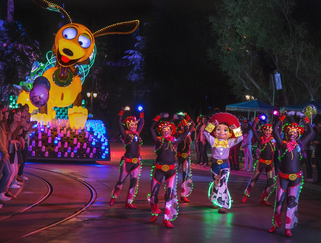 AN ELECTRIC RODEO (ANAHEIM, Calif.) –– Jessie and the Lasso Dancers lead the way for Slinky Dog, Buzz Lightyear and Woody from Disney●Pixar's 'Toy Story' films in this all-new after-dark spectacular at Disneyland park inspired by the iconic 'Main Street Electrical Parade.' 'Paint the Night' is full of vibrant color and more than 1.5 million, brilliant LED lights and features special effects, unforgettable music, and energetic performances that bring beloved Disney and Disney●Pixar stories to life. (Paul HIffmeyer/Disneyland Resort)